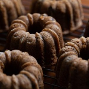 Close-up image of multiple pumpkin chocolate chip mini bundt cakes.