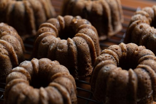 Close-up image of multiple pumpkin chocolate chip mini bundt cakes.